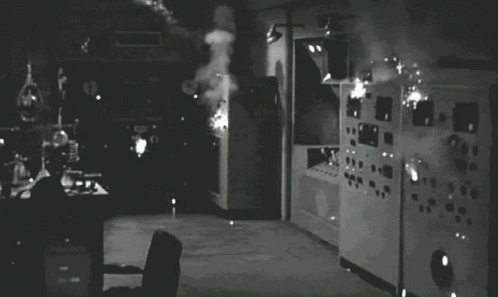 A bunch of sparks emitted from some old-timey "servers", black and white